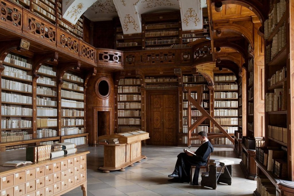 Shelves of old books symbolising stored memories and human recollection.