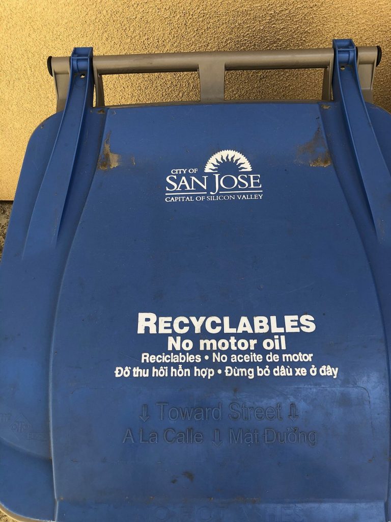 colourful recycling bins outside homes