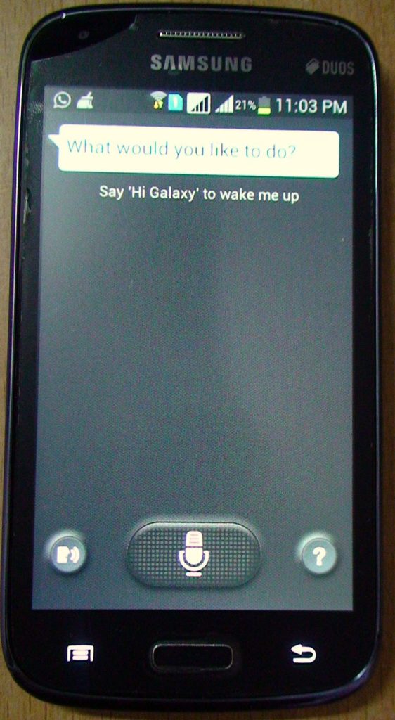A person using a smartphone assistant at home